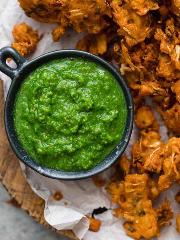 Green Cilantro Chutney served with pakoras or fritters on the side.