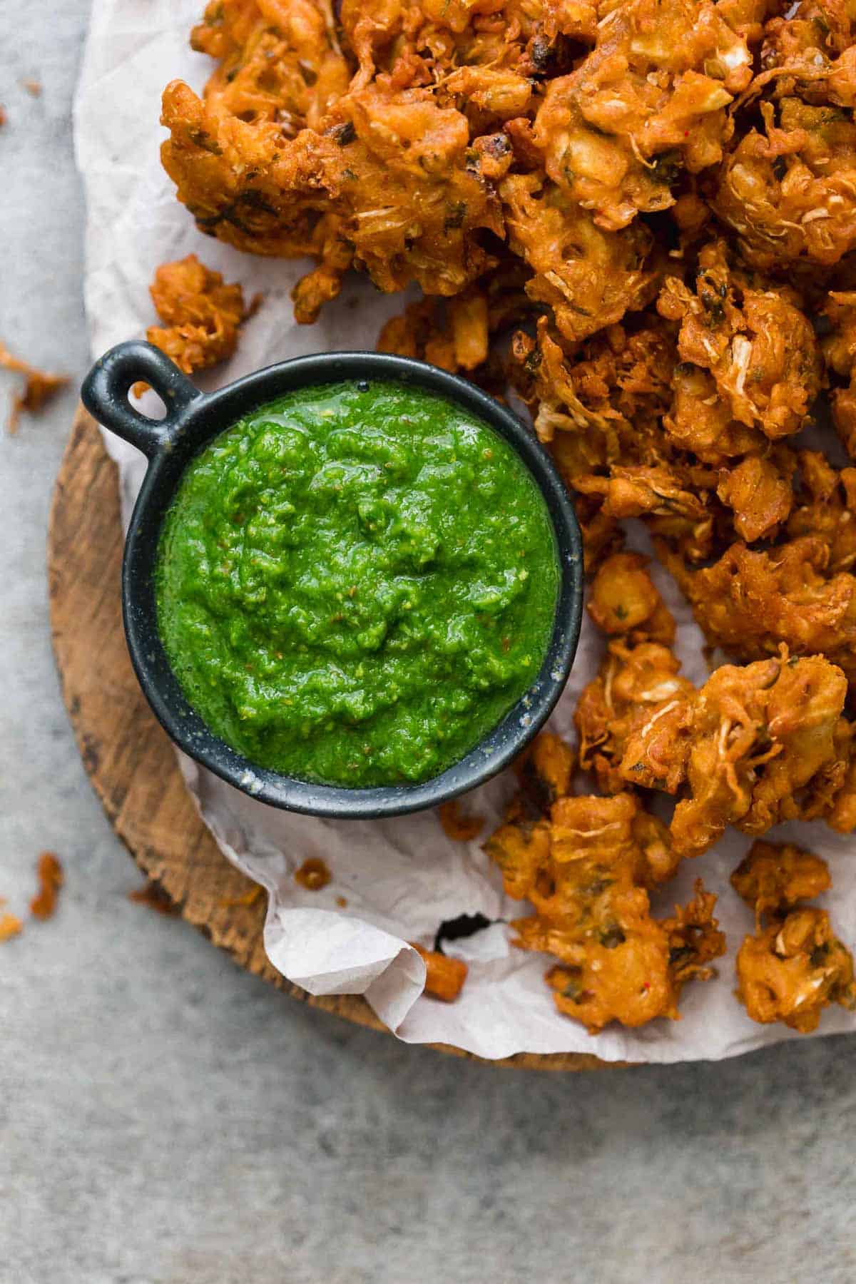 Green Cilantro Chutney served with pakoras or fritters on the side.