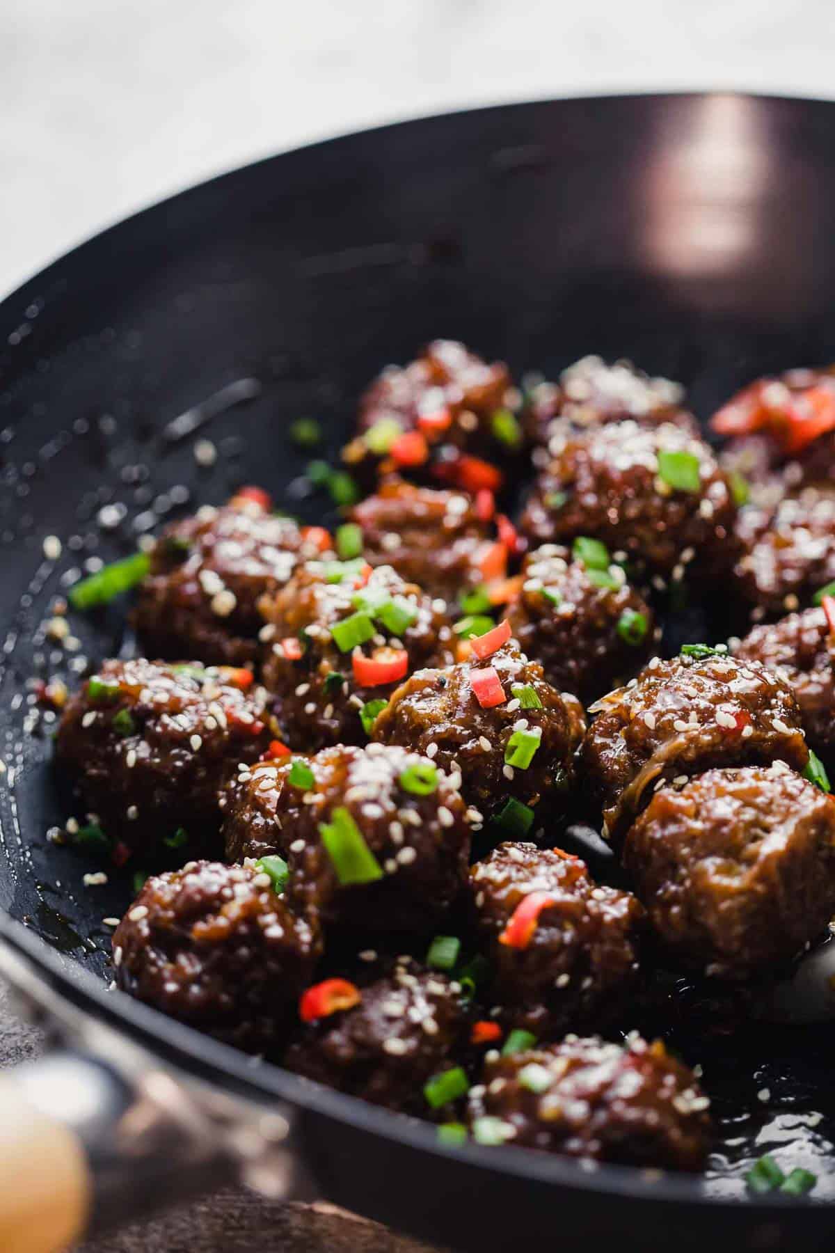 Sticky Thai Meatballs tossed in a wok