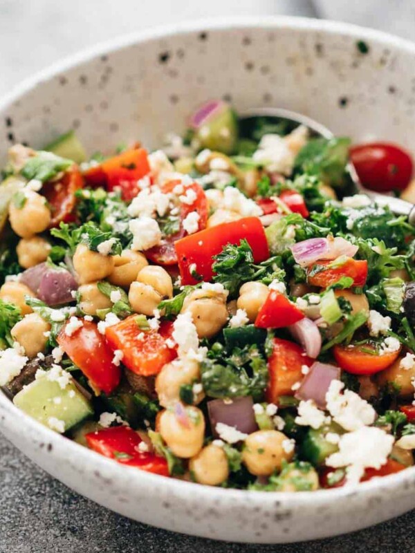 Easy Mediterranean chickpea salad served in a ceramic bowl with a spoon