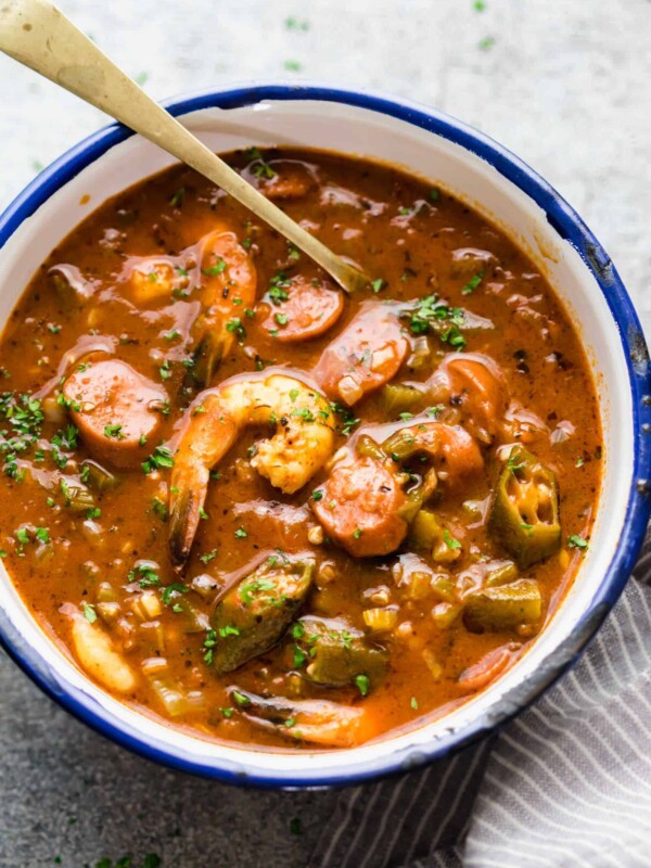 New Orleans Shrimp Sausage Gumbo served in an enamel bowl with a spoon