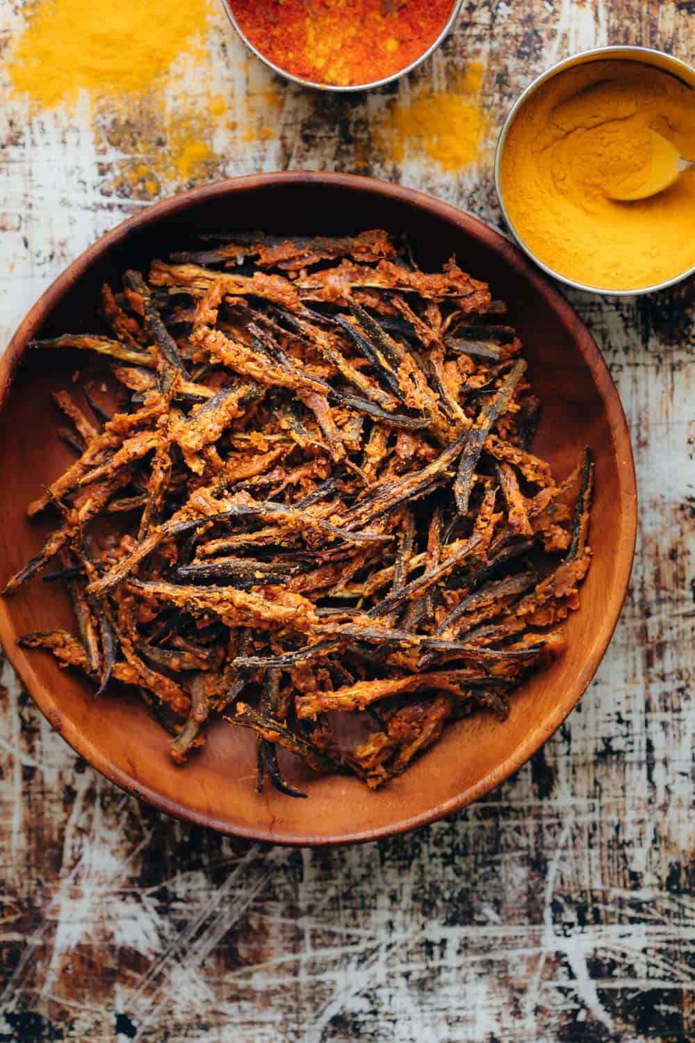 Baked kurkuri bhindi in a brown bowl