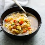 Detox cabbage soup served in a black bowl