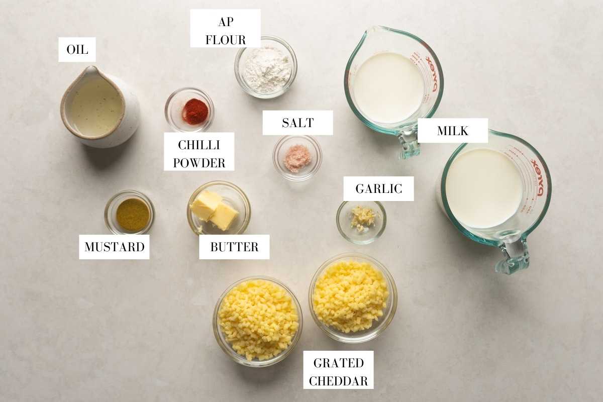 Picture of all the ingredients you need for cheese sauce with text overlay