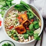 Vegetarian pho soup served in a bowl with lots of toppings
