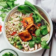 Vegetarian pho soup served in a bowl with lots of toppings