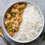 Easy chicken korma served in a bowl with rice