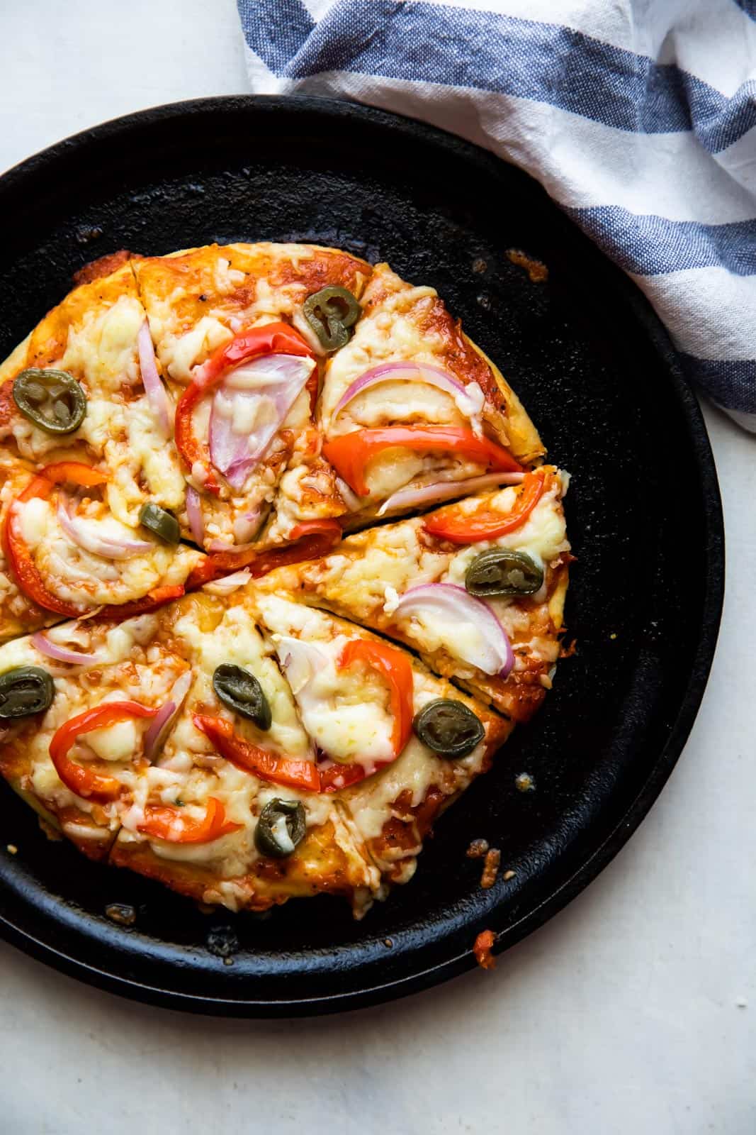 No yeast Pizza cooked on a cast iron skillet