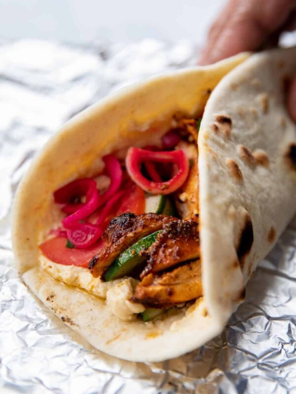 Chicken shawarma wrap waiting to be picked up and eaten