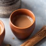 Masala Chai served in a terracota mug