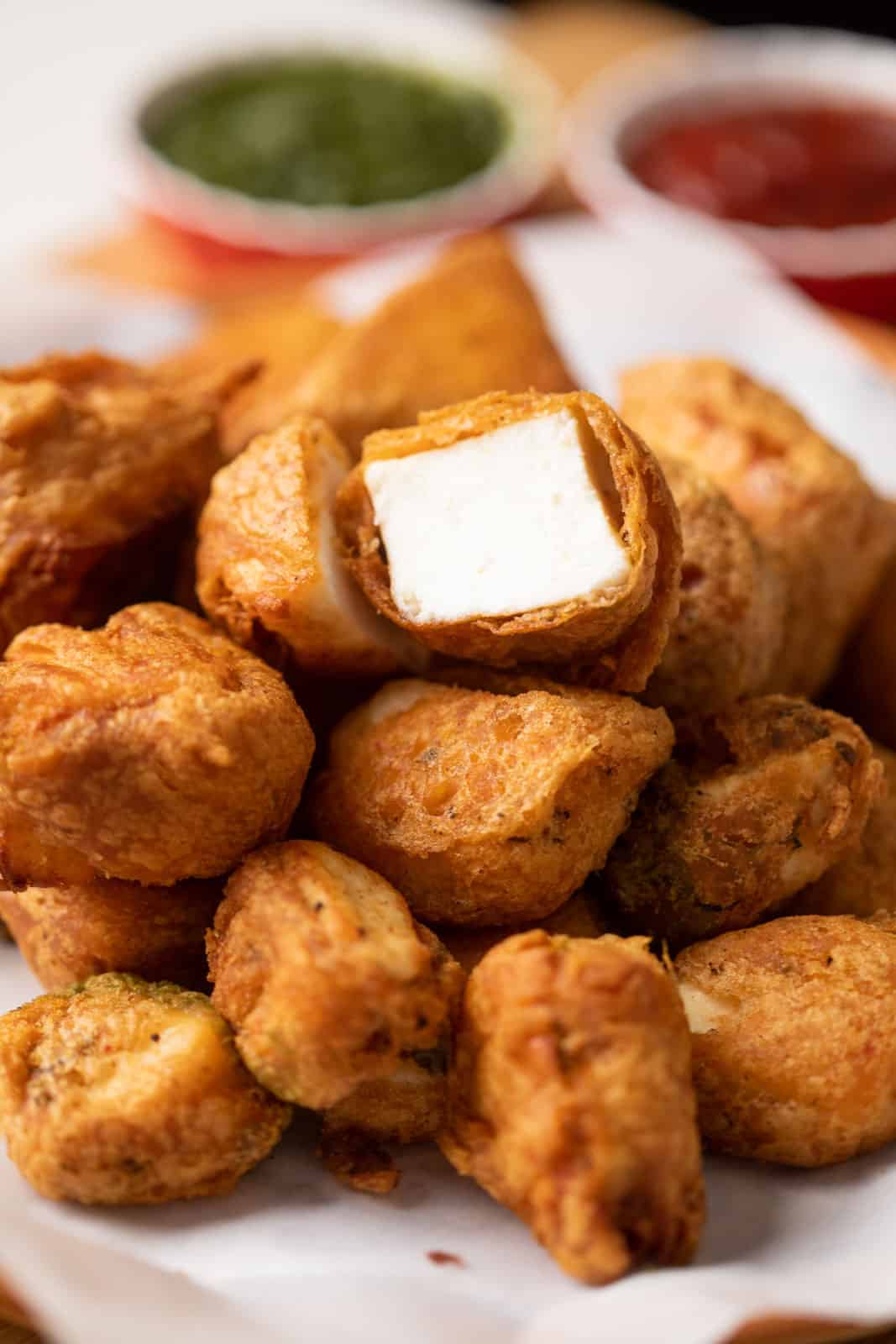 Closeup of a bite of plain paneer pakora