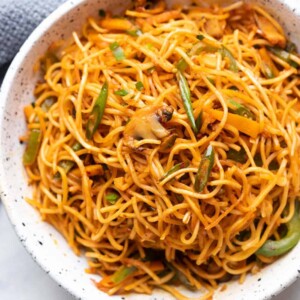 Chilli Garlic noodles served in a white textured bowl