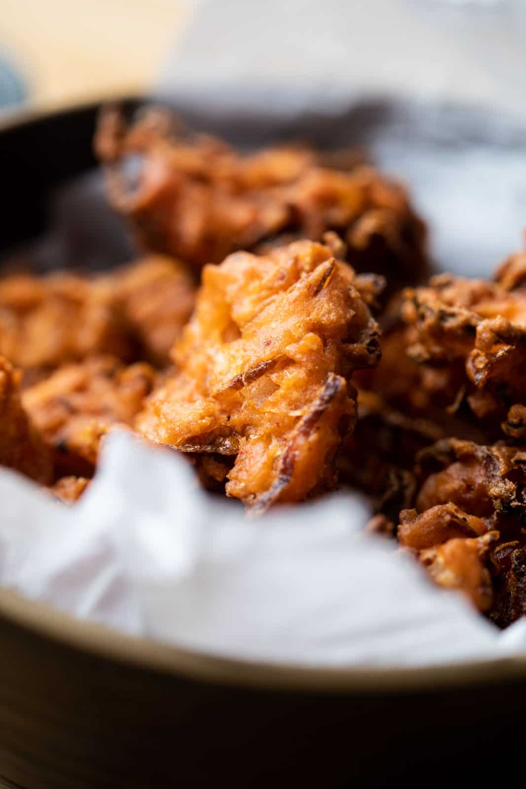 Closeup of onion pakodas served in a bowl
