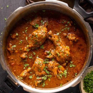 Dhaba style chicken curry served in the pressure cooker it was made in