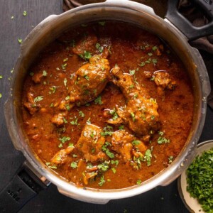 Dhaba style chicken curry served in the pressure cooker it was made in