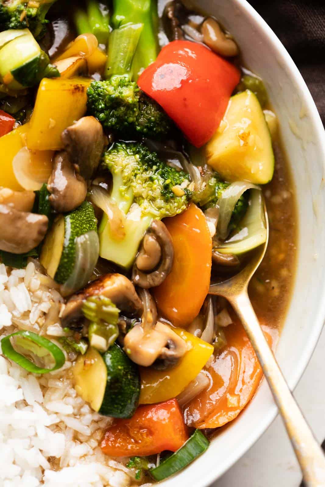 Closeup of Asian Veg Stir Fry served in a bowl over white rice