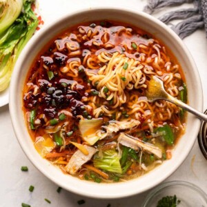 Chicken thukpa served with ramen noodles, veggies and some bok choy and spring onions on the side