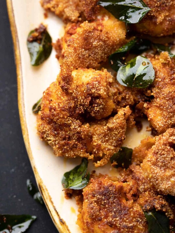 Closeup of prawn rava fry on a beige platter