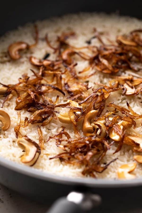 Closeup of the fried onions and cashew topping on ghee rice
