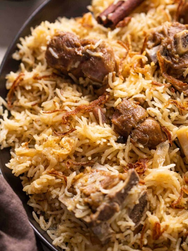 Closeup of yakhni pulao to show the texture of rice and mutton pieces