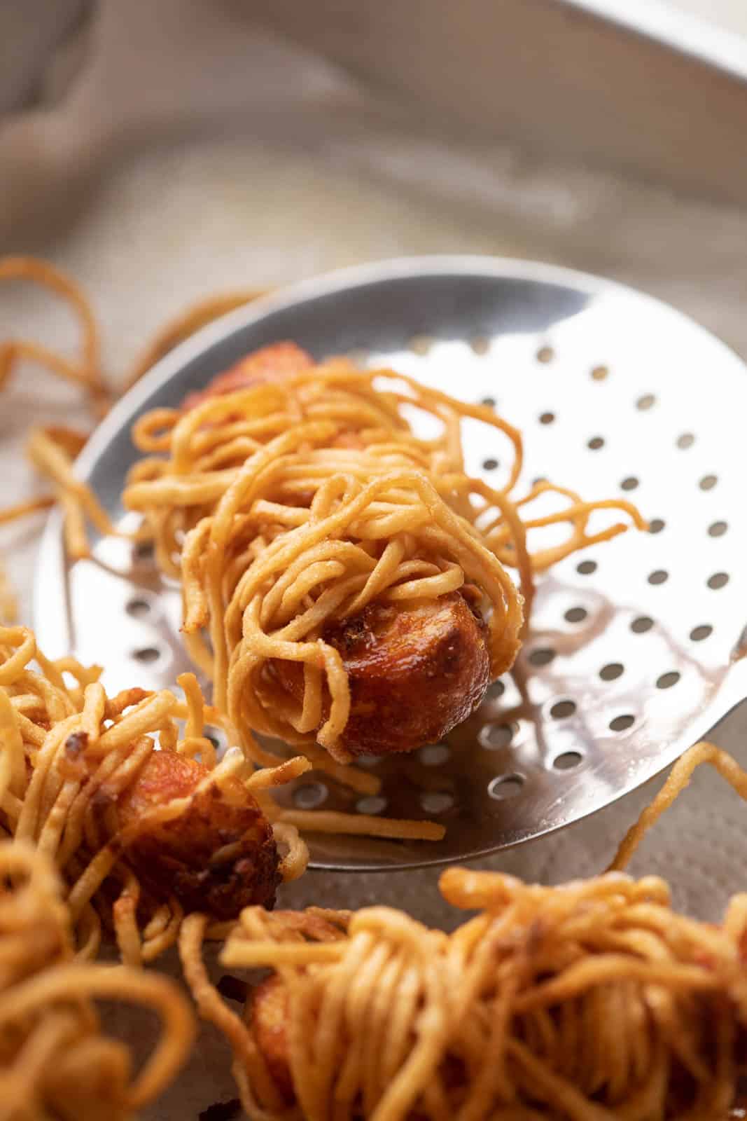 Thread paneer taken out of hot oil