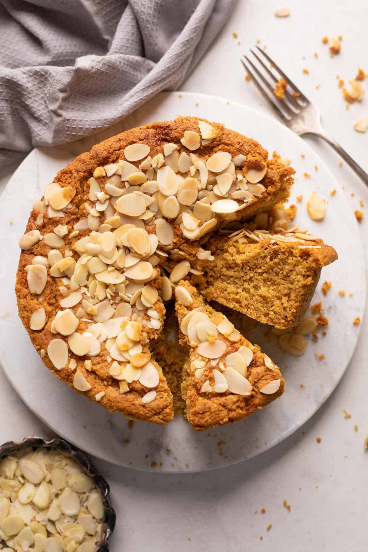 Mawa cake sliced and served on a white platter