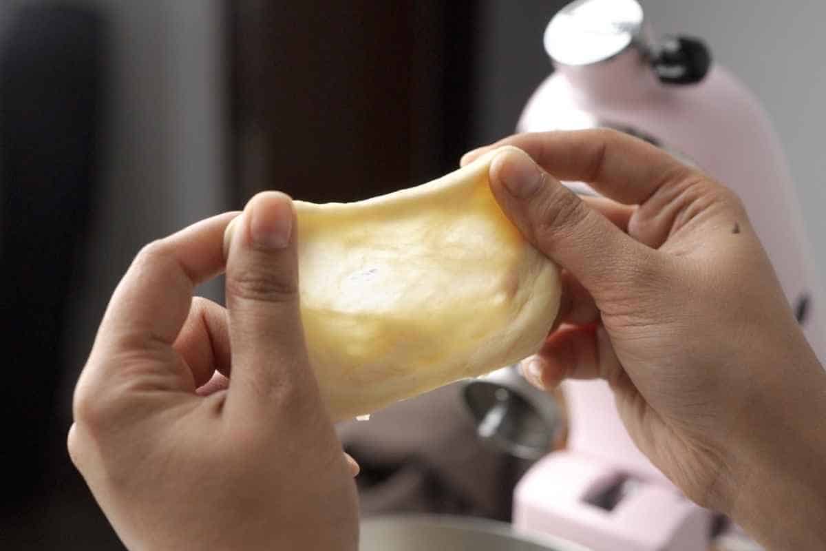 a close up shot of the stretched out dough