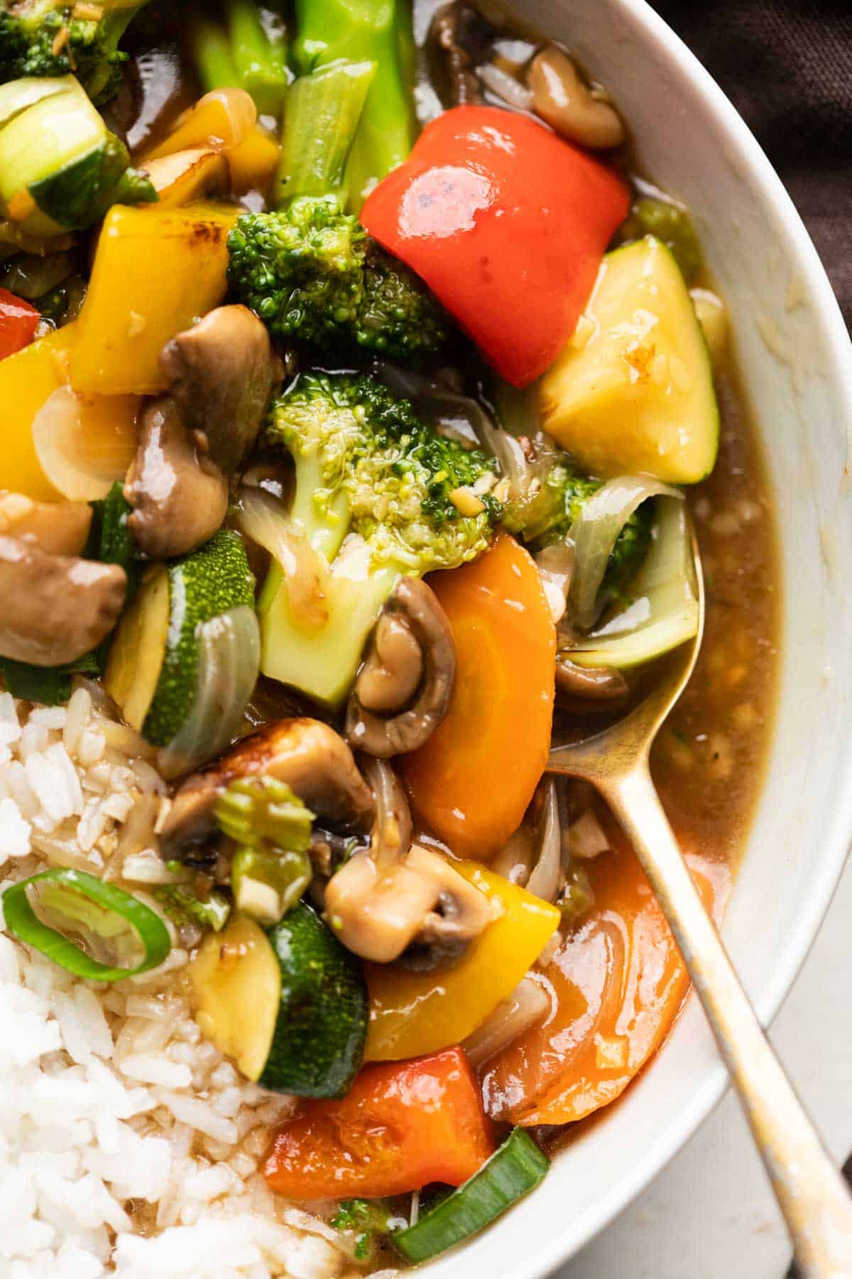 Closeup of Asian Veg Stir Fry served in a bowl over white rice