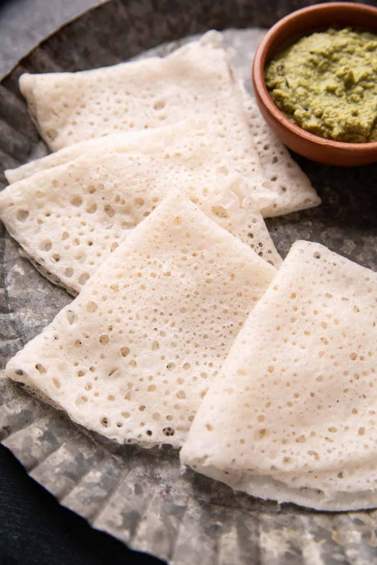 Close up of neer dosa served on a plate