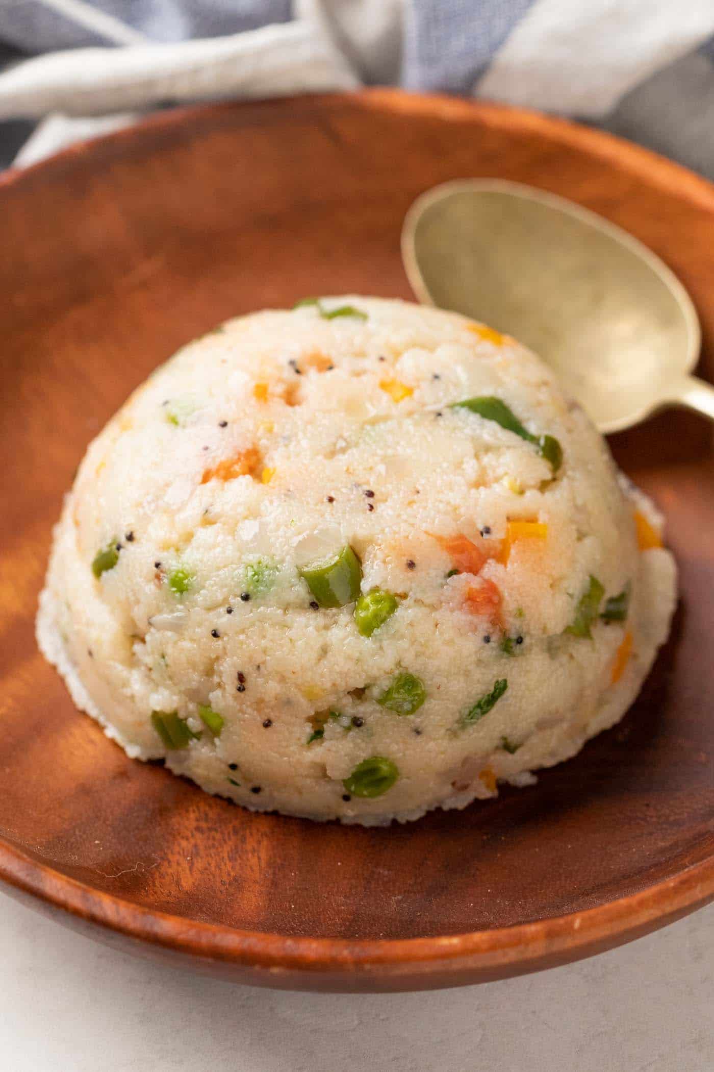 Upma served on a brown plate