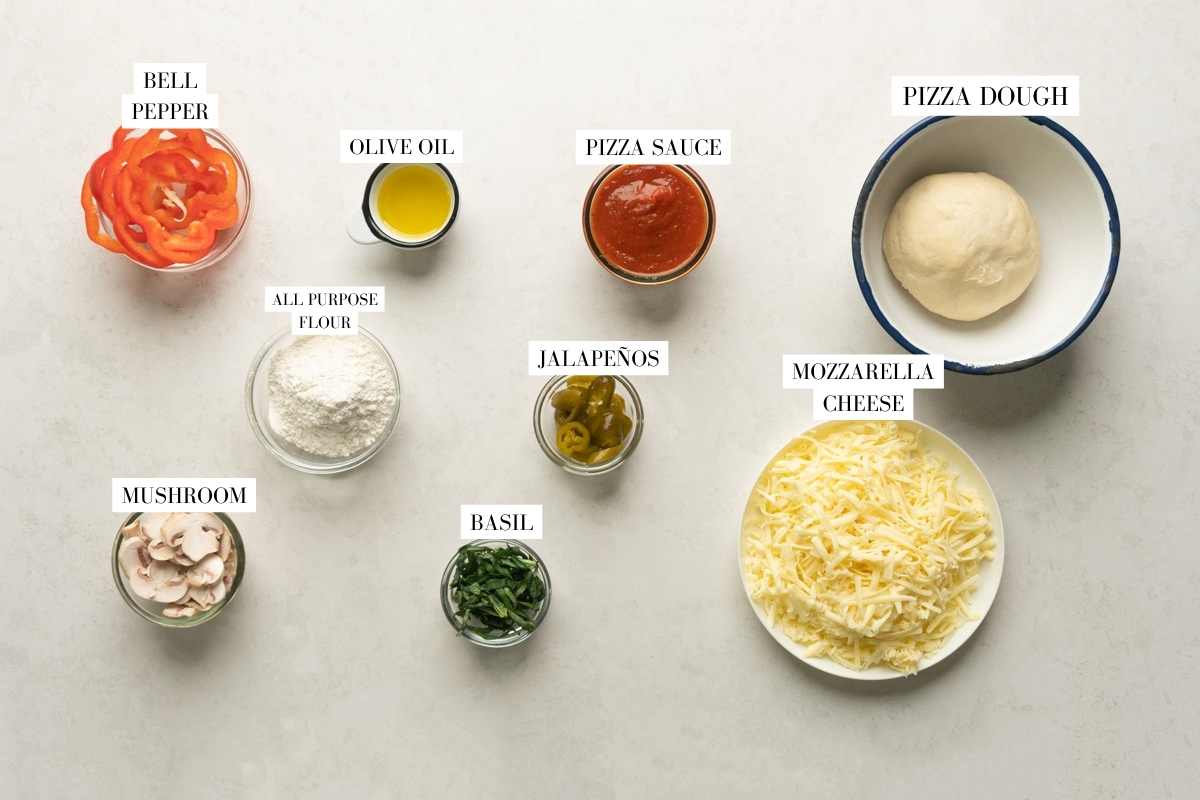 Picture of all the ingredients required for the air fryer baked pizza with text to identify them