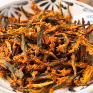 Air fried kurkuri bhindi in a white bowl