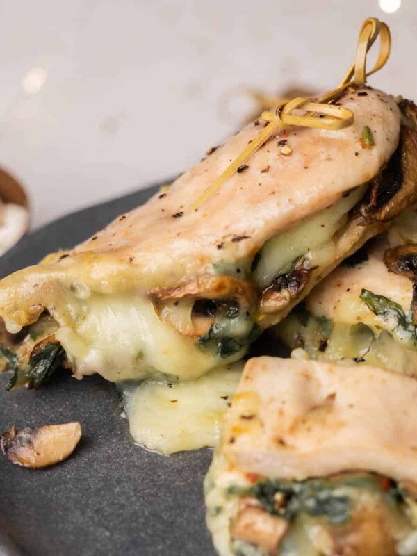 Spinach Mushroom Stuffed Chicken Breast plated on a grey plate