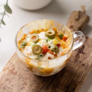 shot of microwave pizza in a mug