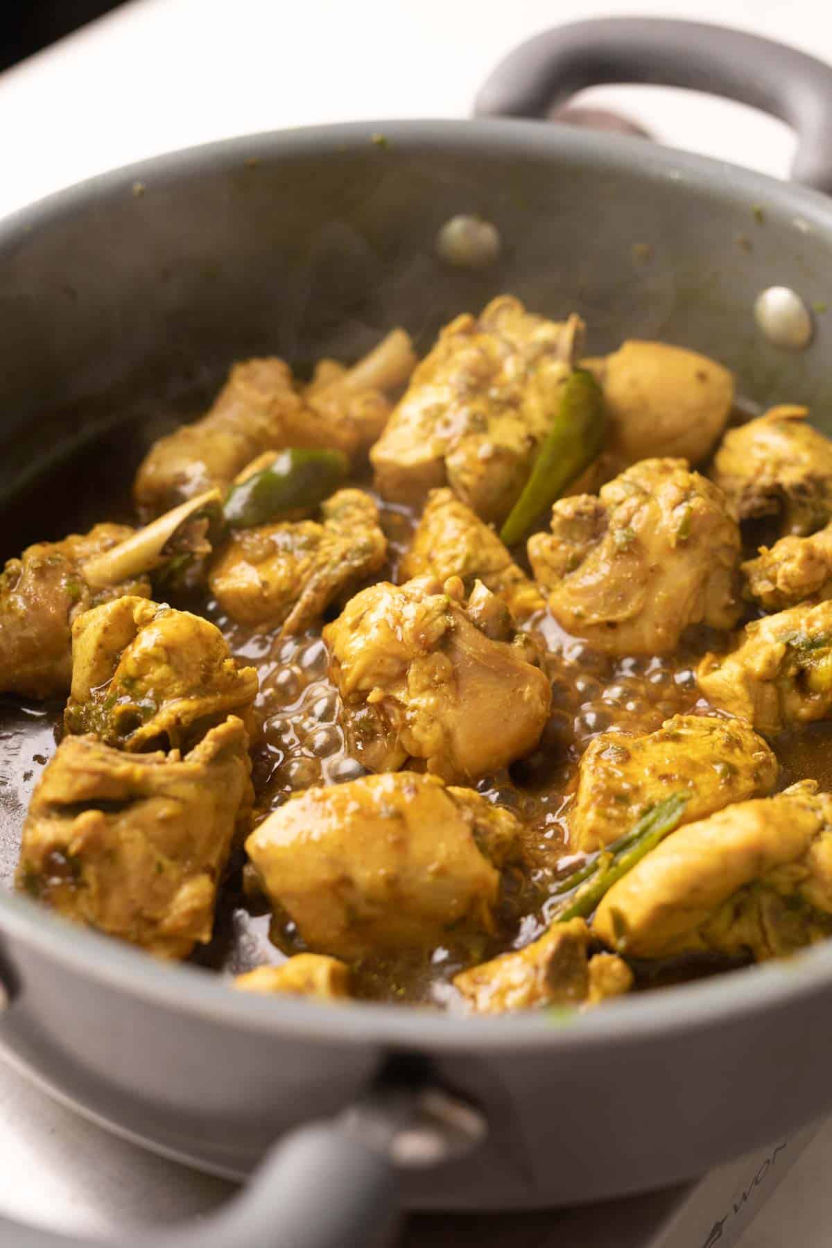 shot of andhra chilli chicken in a kadai