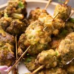 plate of malai broccoli on skewers