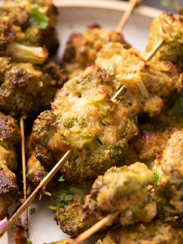 plate of malai broccoli on skewers