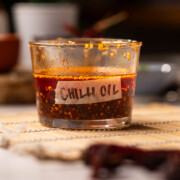 homemade chilli oil stored in a transparent, labelled container