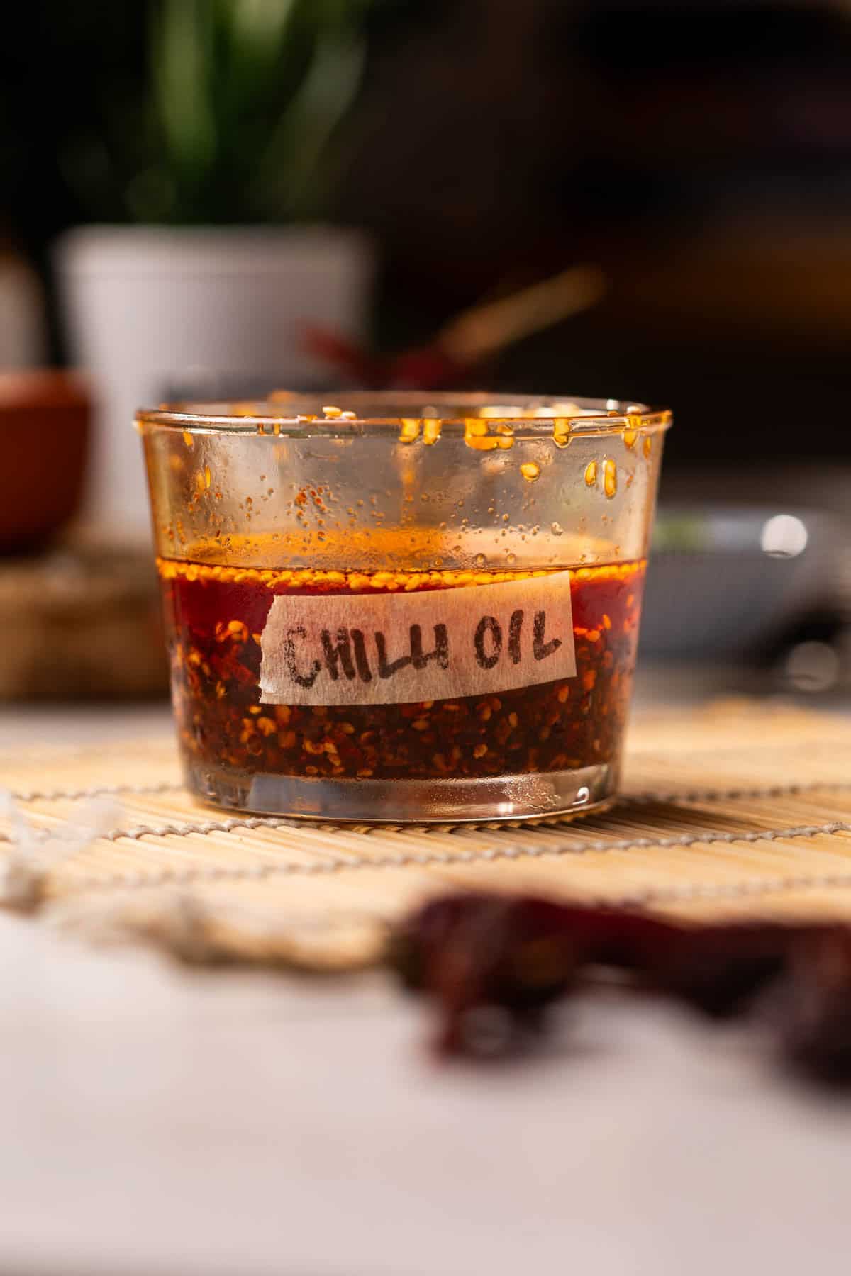 homemade chilli oil stored in a transparent, labelled container
