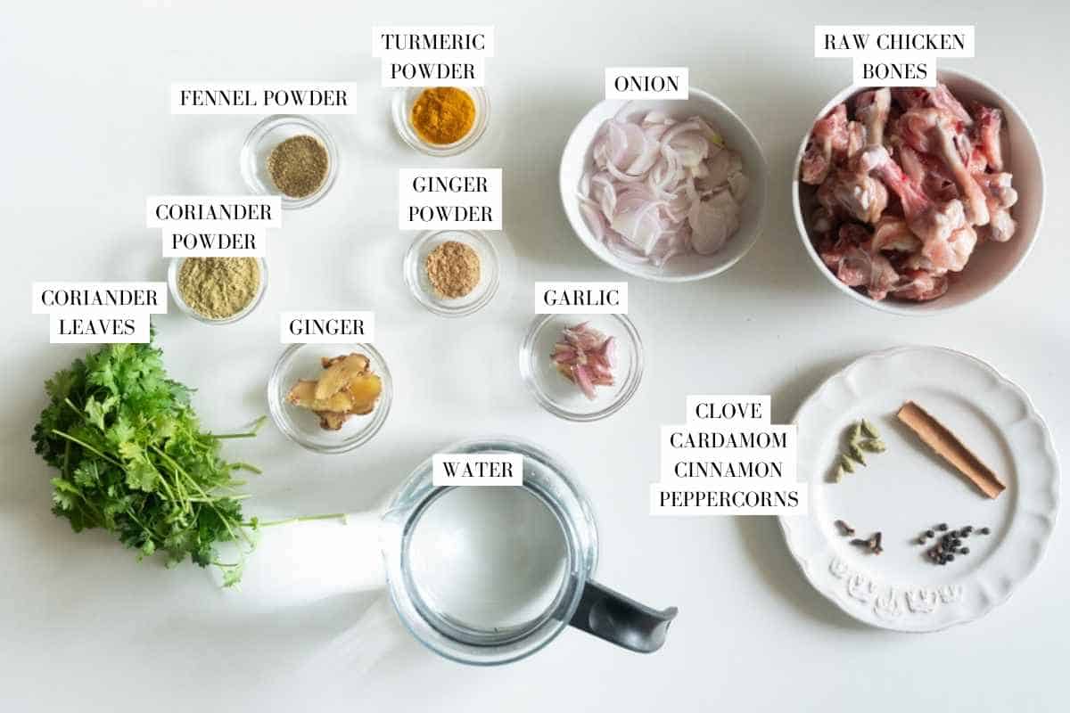Picture of all the ingredients for Turmeric Chicken Broth with text to identify them