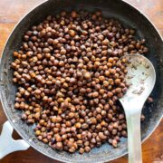 Kala chana pictured in the iron pan it was cooked in