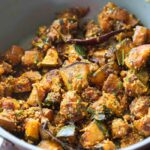 peanut pumpkin sabzi in a grey kadai garnish with coriander leavese