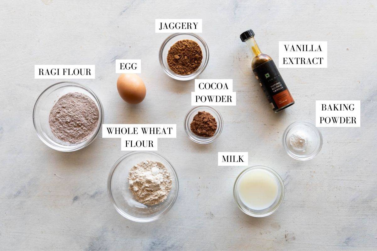 Ingredients for ragi pancakes laid out with text overlay to identify them