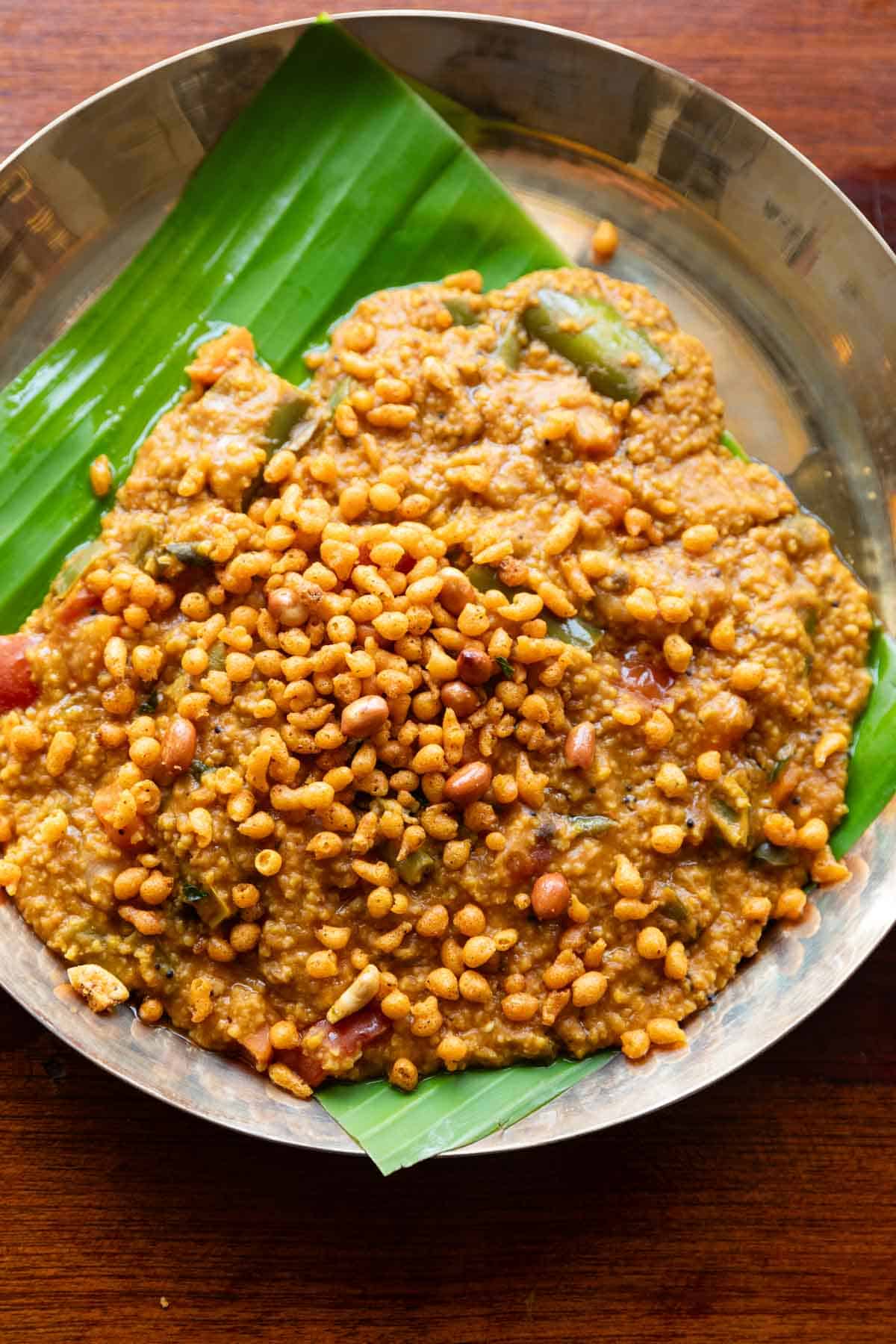 Millet bisi bele bath served on a plate lined with banana leaf