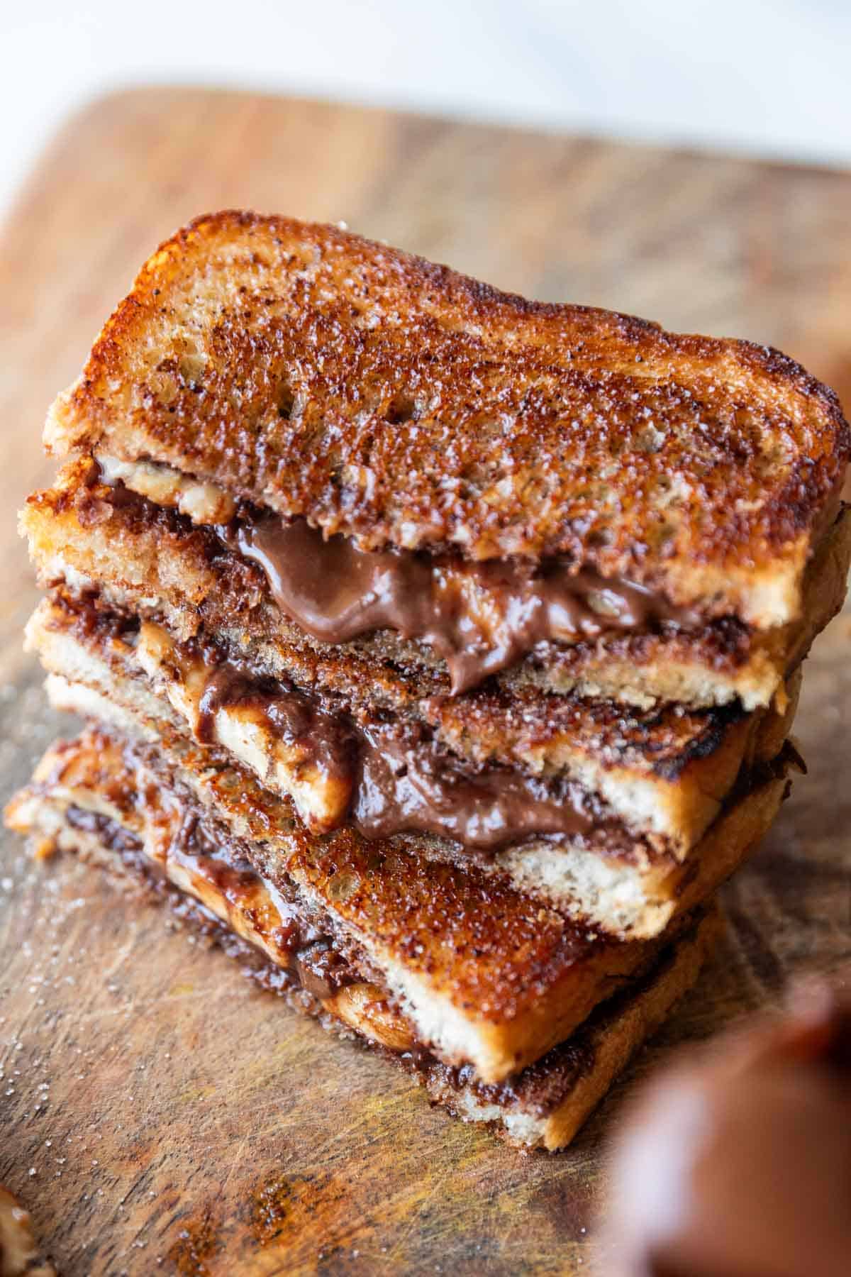 grilled chocolate banana sandwich on a wooden board