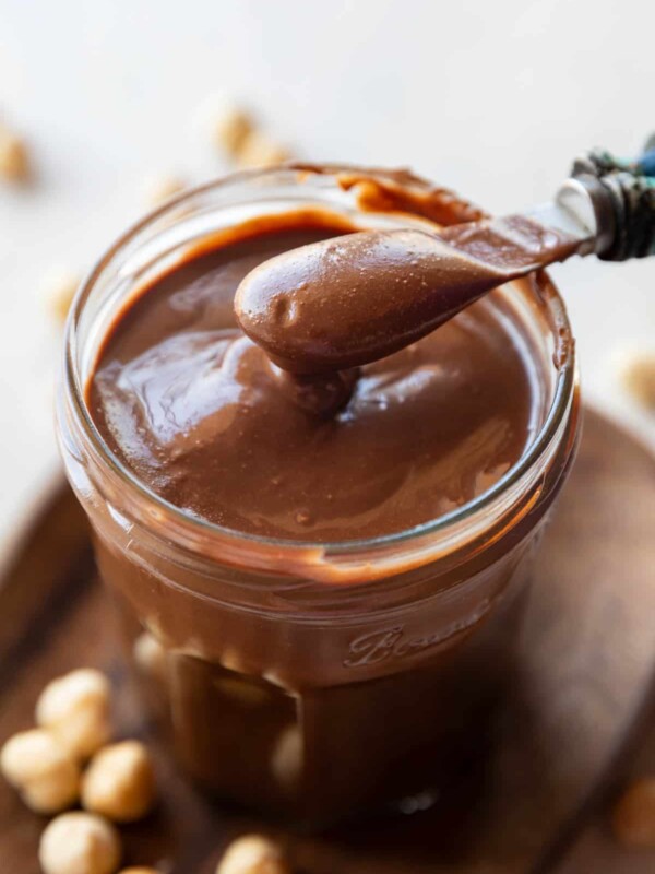 Homemade Nutella chocolate spread in a jar with spoon