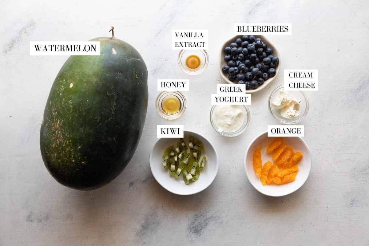 Watermelon pizza ingredients on a white background with text overlay