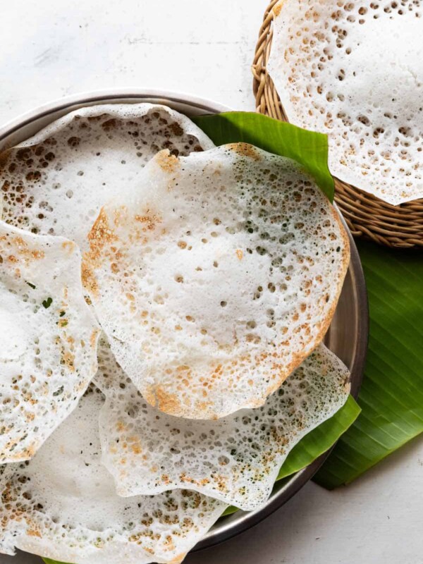 tender coconut appam placed on banana leaf ready to serve