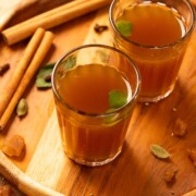 kadha garnished with fresh tulsi leaves