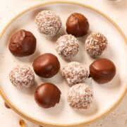 peanut butter oats energy balls with dates served on a white plate